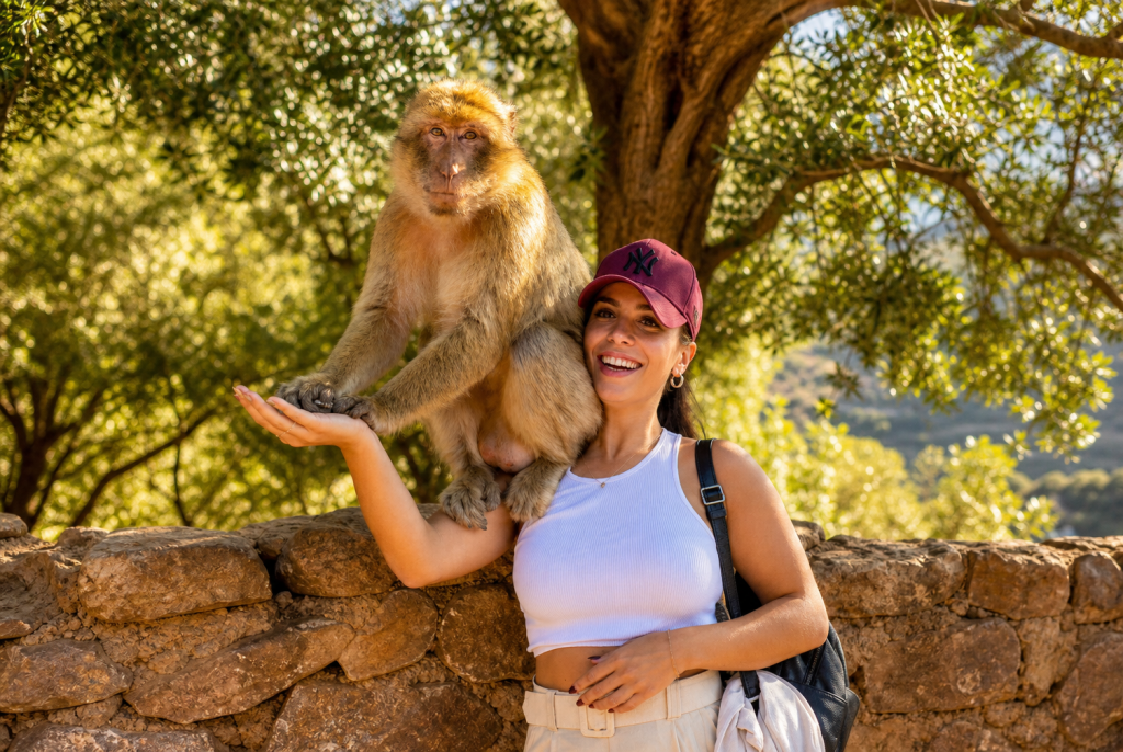Tourist with Barbary Macaque Ouzoud Waterfalls